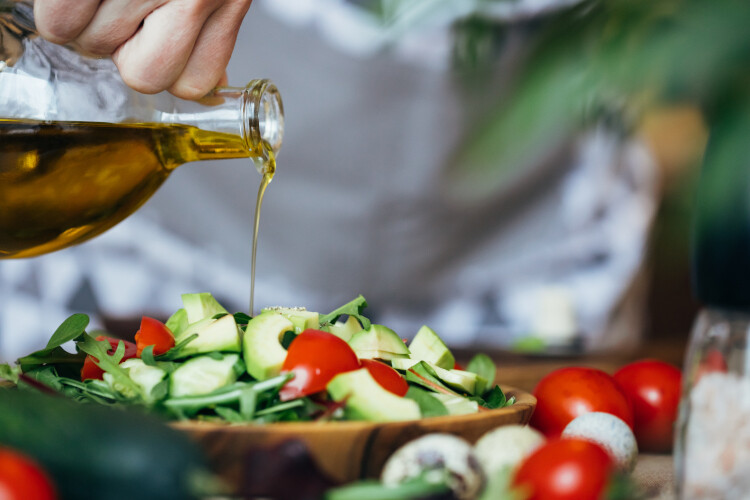 olive-oil-pouring-on-salad-2021-09-01-02-47-34-utc