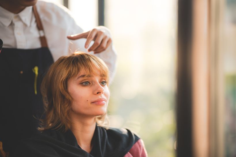 Hairdresser giving treatment and barber occupation service, Professional hairstylist/ envato