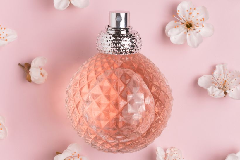 Perfume bottle and white flowers, envato